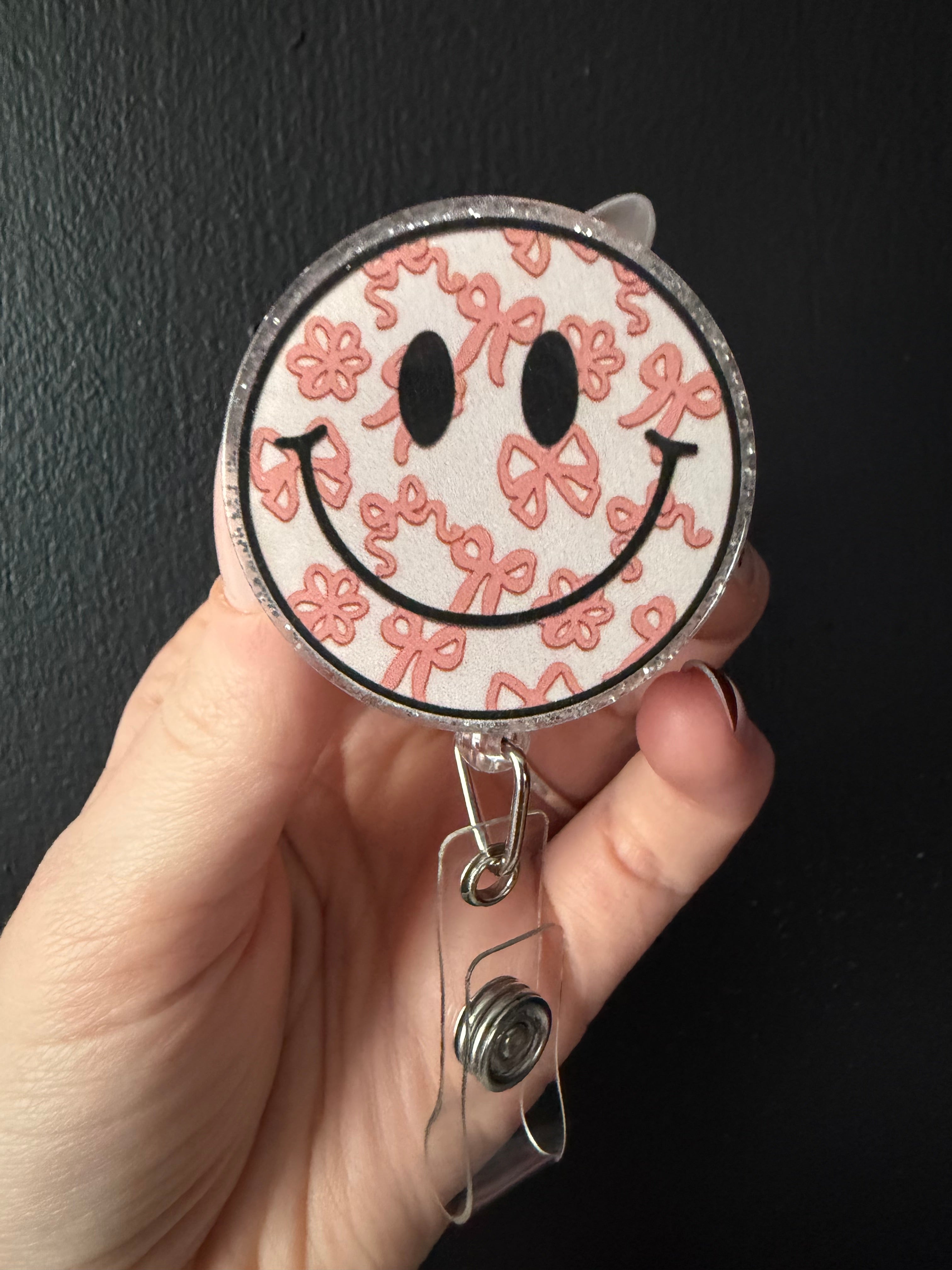 Smiley Bow Badge Reel